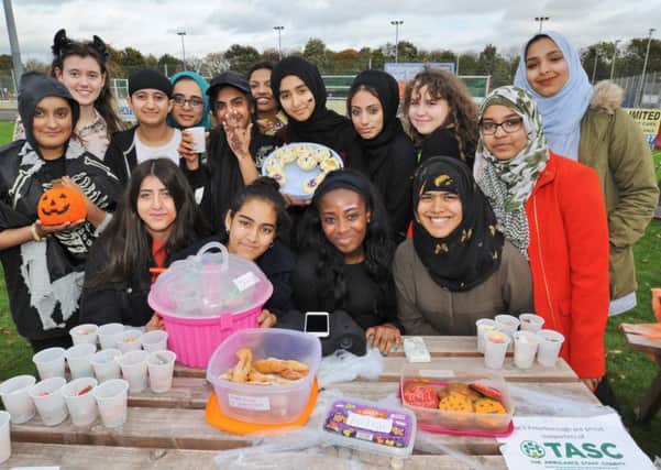 Youngsters from ther NCS group fundraising for the ambulance service at the Peterborough Town sports ground EMN-171024-184938009