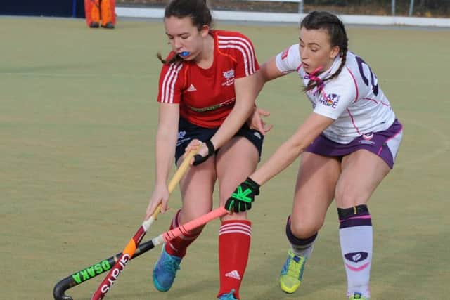 Action from a cup match between City of Peterborough Ladies (red) v Loughborough Students.