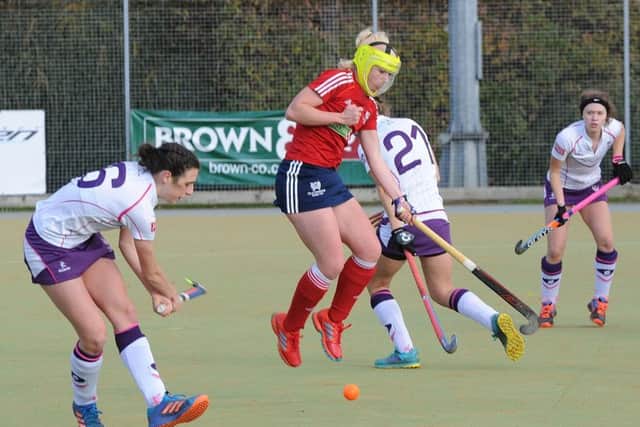 Action from City of Peterborough Ladies (red) v Loughborough Students.