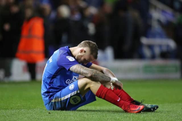 Posh star Marcus Maddison cuts a dejected figure after the home defeat at the hands of Blackpool. Photo: Joe Dent/theposh.com