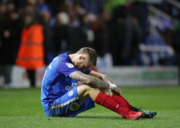 Posh star Marcus Maddison cuts a dejected figure after the home defeat at the hands of Blackpool. Photo: Joe Dent/theposh.com