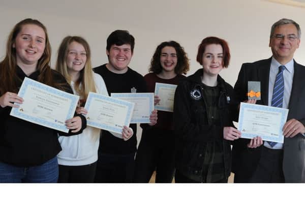 Martin Steele, chairman of Safapac Holdings, presents the awards to students, from left ,  Kathryn Paternoster, Emma Hunt, Jake Smith, Megan Childs and Katie Wright.