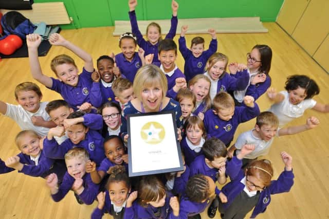 Head teacher  Sue Blyth with pupils at Fourfields School, Yaxley -   the happiest school in the country. EMN-171120-161209009
