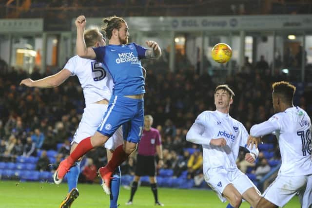 Posh striker Jack Marriott challenges for a cross in the game against Portsmouth. Photo: David Lowndes.
