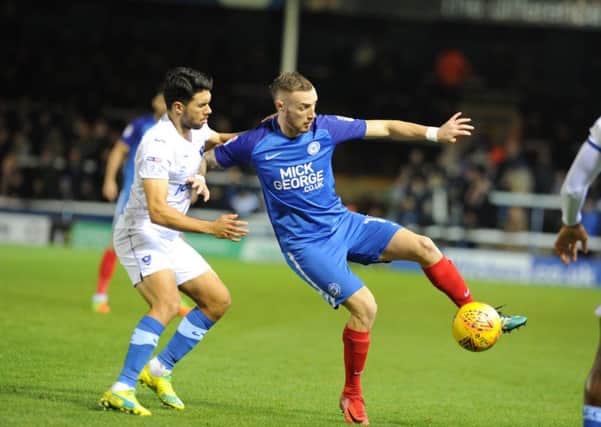 Marcus Maddison on the ball for Posh against Portsmouth. Photo: David Lowndes.