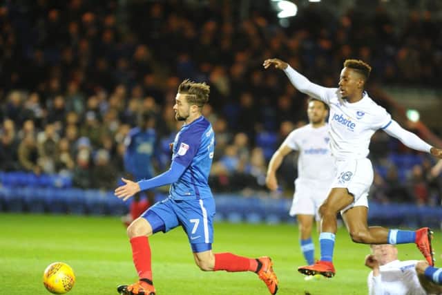 Gwion Edwards surges forward for Posh in their 2-1 win over Portsmouth. Photo: David Lowndes.