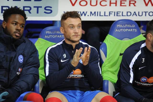 Ricky Miller on the Posh substitutes' bench. Photo: David Lowndes.