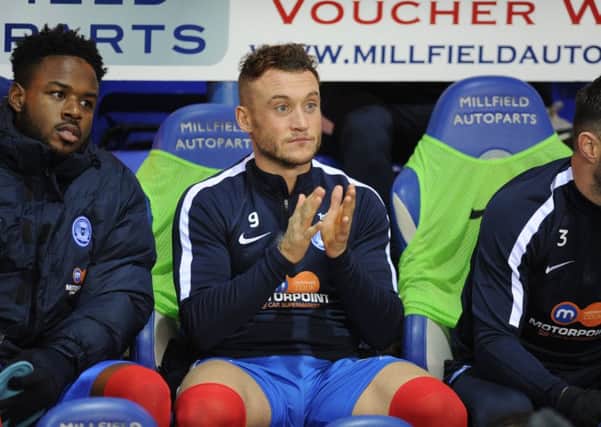 Ricky Miller on the Posh substitutes' bench. Photo: David Lowndes.