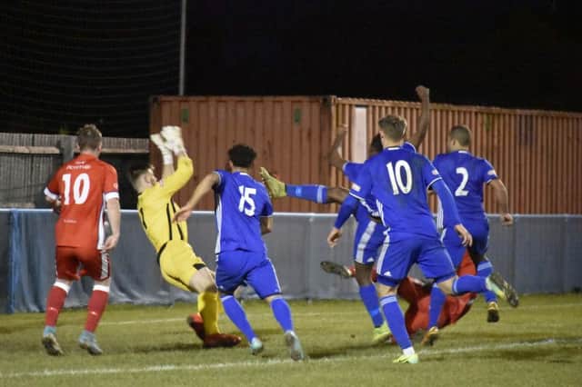 Action from Peterborough Sports' (blue) defeat at home to Chasetown last weekend. Photo: James Richardson.